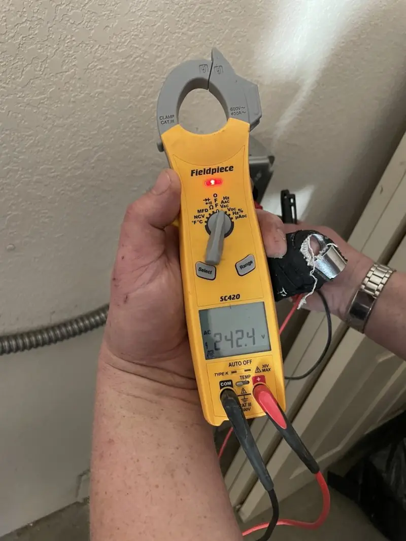 Voltage testing with clamp meter during Ceiling Fan Installation in Waldwick